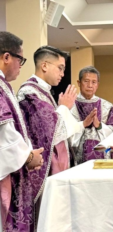 About 2 Priests celebrating Catholic Mass at an altar